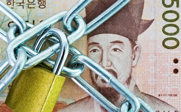 Korean won note behind lock