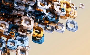 Abstract 3D rendering of a cluster of transparent, marbled square torus shapes in blue, gold, and white hues, floating against a soft gradient background. The geometric forms are densely packed on one side and disperse outward, evoking a dynamic sense of motion and digital complexity