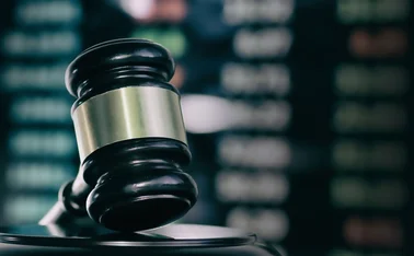 Gavel against a trading screen