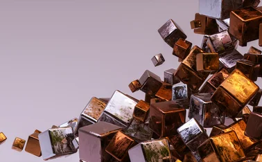Abstract 3D composition of reflective metallic cubes in copper, bronze, silver and gold tones, clustered and floating diagonally across a soft lavender background