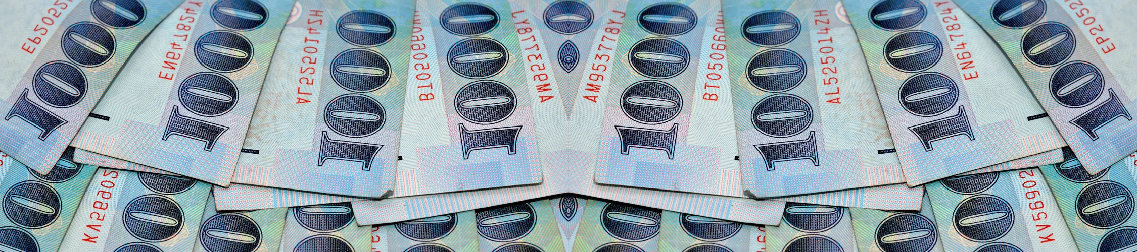 New Taiwan dollar banknotes spread out and overlapping