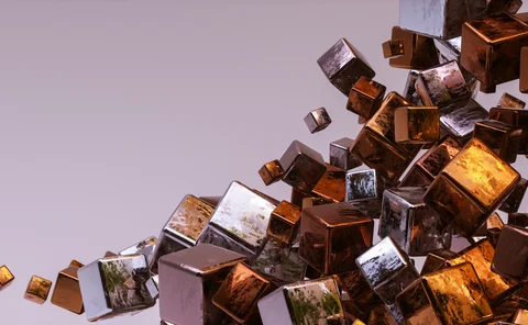 Abstract 3D composition of reflective metallic cubes in copper, bronze, silver and gold tones, clustered and floating diagonally across a soft lavender background
