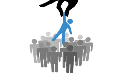 Hand choosing a person from a group of symbol people