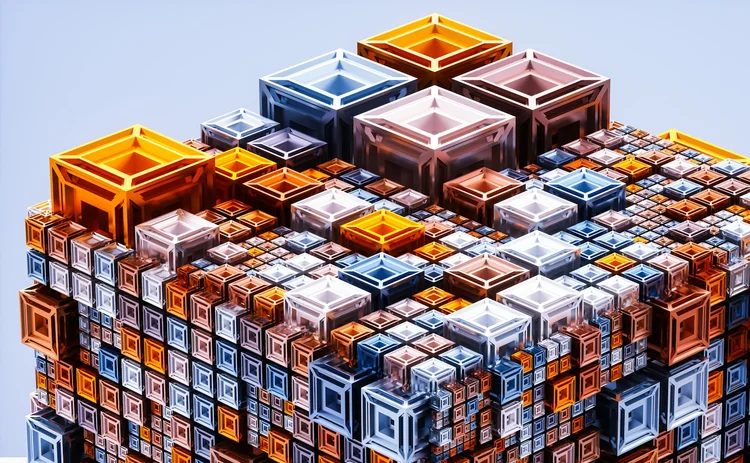 3D-rendered abstract structure composed of layered, transparent cubes in varying sizes and colours – primarily orange, blue and white – stacked in a geometric, isometric pattern against a light blue background