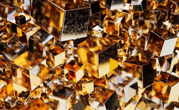 Abstract composition of numerous reflective gold and bronze metallic cubes floating in a dense, three-dimensional arrangement.