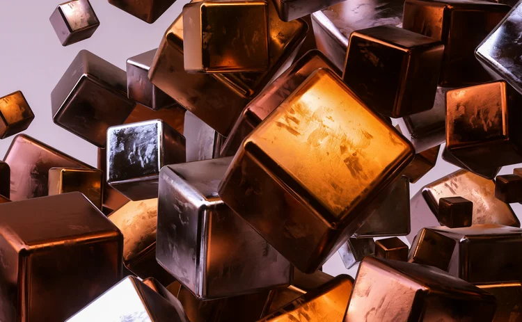 Close-up of glossy bronze and chrome cubes tumbling and floating in an abstract composition
