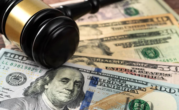 Court ruling on cash A gavel rests on some currency notes