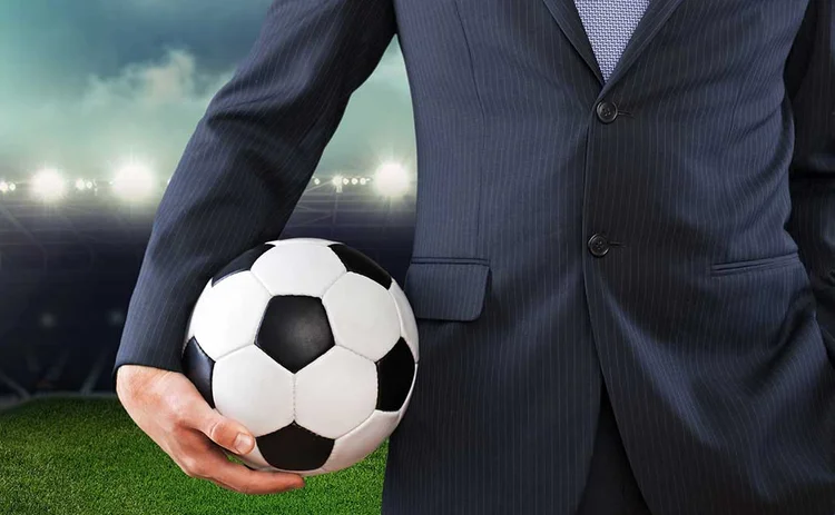 Businessman with football Businessman with football