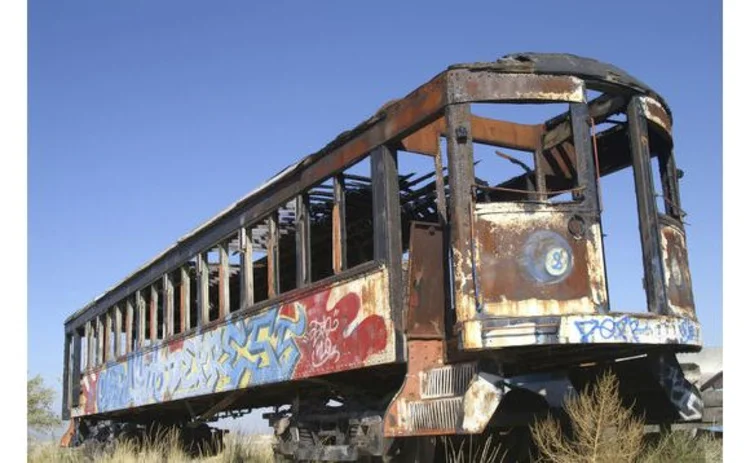 train-carriage-wreck-abandoned-derelict-burnt-graffiti-paint