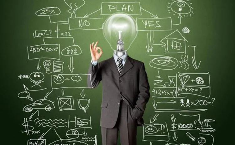 A businessman with a light-bulb head representing an idea A businessman with a light-bulb head representing an idea