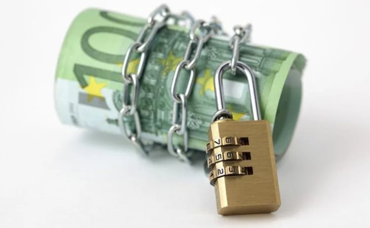 A roll of euros in a padlock A roll of euros in a padlock