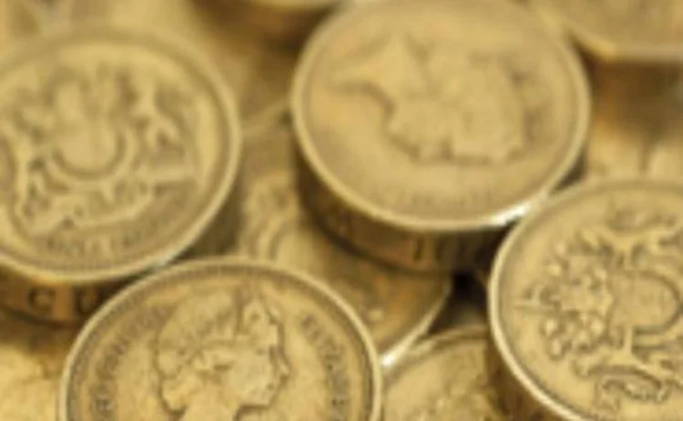 A pile of one-pound coins A pile of one-pound coins