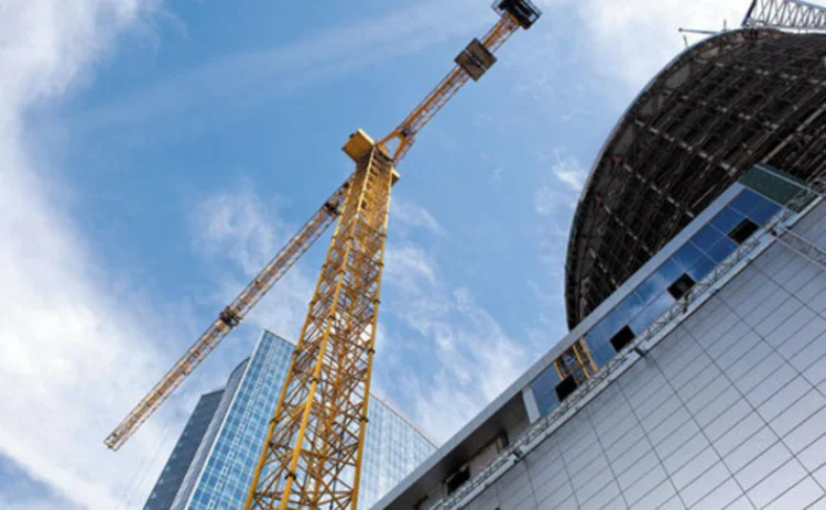 A crane at a skyscraper building site