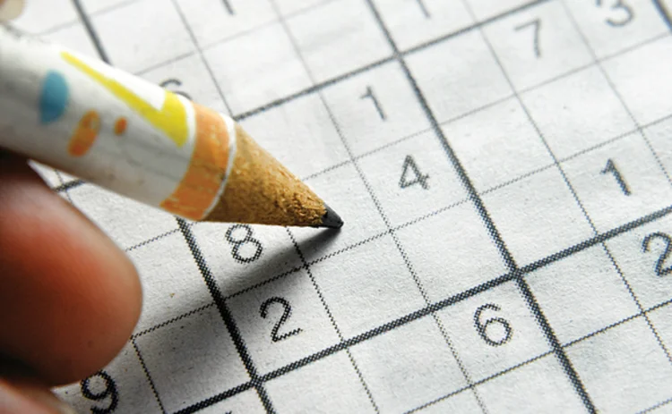 Solving a sudoku puzzle with a pencil Solving a sudoku puzzle with a pencil