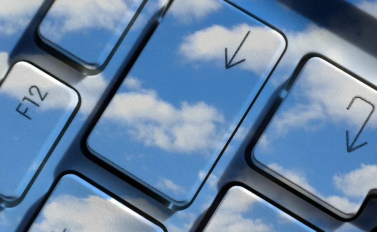Clouds superimposed on a computer keyboard Clouds superimposed on a computer keyboard