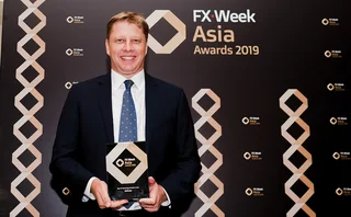 Nigel Fuller accepts Refinitiv’s awards at the FX Week Asia Awards ceremony in Singapore