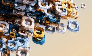 Abstract 3D rendering of a cluster of transparent, marbled square torus shapes in blue, gold, and white hues, floating against a soft gradient background. The geometric forms are densely packed on one side and disperse outward, evoking a dynamic sense of motion and digital complexity