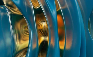 Abstract close-up of smooth metallic and blue flowing shapes with gold reflections, representing fluidity, transformation, and the fusion of art and technology.