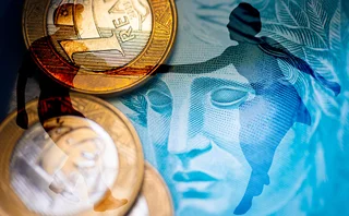 A couple jive dancing superimposed over Brazilian currency image