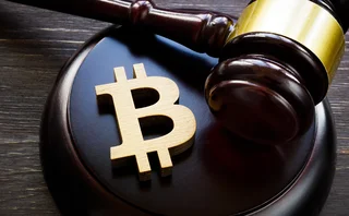 Gavel next to a bitcoin currency symbol