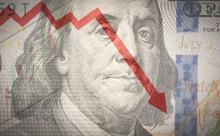 A dollar note with a downward pointing arrow overlaid
