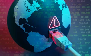 An ethernet cable plugged into a world globe has an error icon above it