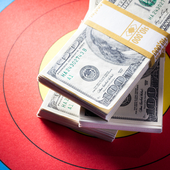 Pile of dollar notes on an archery target board