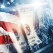 An American flag with a $100 note and an abstract financial graph