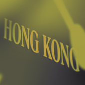 Hong Kong signage behind clock detail