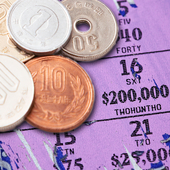 Yen coins on lottery scratchcard